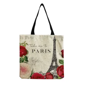 Detailed view of the vintage Eiffel Tower tote bag showcasing intricate rose print and text.