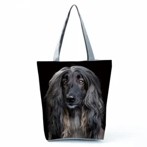 Detailed view of large capacity black dog print canvas shoulder tote bag with zipper closure.