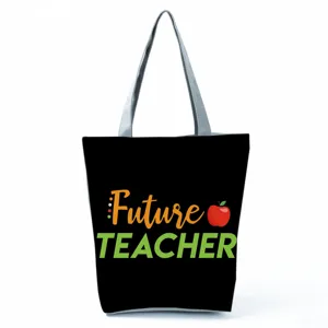 Detailed view of teacher tote bag with Future Teacher print and sturdy gray shoulder handles.