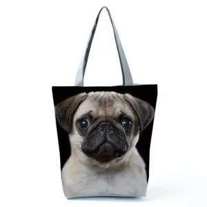 Pug dog print tote bag detail view, casual shoulder bag with comfortable grey handles.