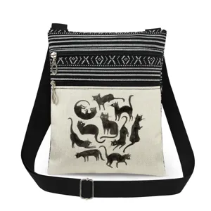 Black cat print crossbody messenger bag with adjustable strap and double zipper pockets.