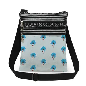 Detailed view of lightweight crossbody bag with black white stripes and floral print.