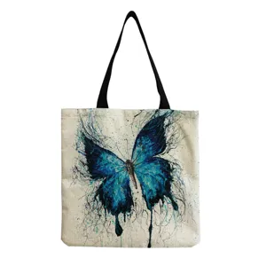 Detailaufnahme des Leinen-Einkaufsbeutels mit wunderschönem blauen Tintenspritzer-Schmetterling.