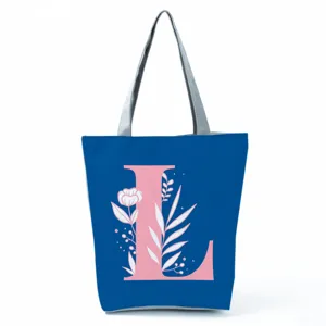 Blue background pink letter floral print tote bag detail shot showing exquisite design patterns.