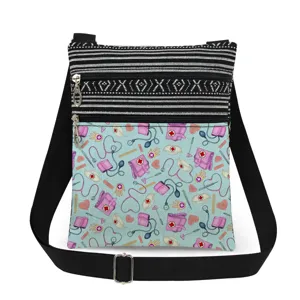 Medical print crossbody bag with double zippers, adjustable strap, and striped top design.