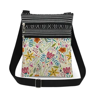 Casual floral crossbody bag with dual zipper compartments and adjustable black strap.