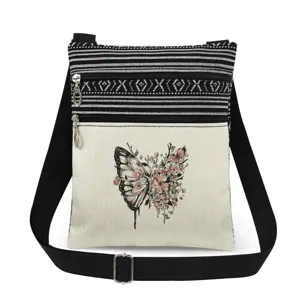 Bolso cruzado de lona con doble cremallera y estampado floral de mariposas.