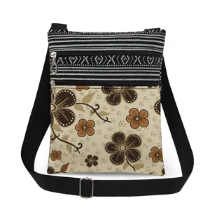Small floral print crossbody bag with double zippers and adjustable strap for women.