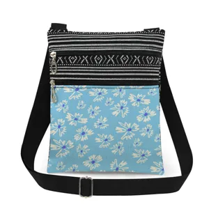 Floral print crossbody bag with black white striped pattern, double zipper and adjustable strap.