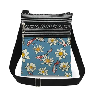 Canvas crossbody bag with koi fish water lily print, double zipper, adjustable strap.