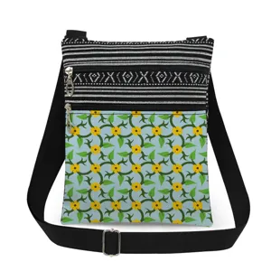 Canvas crossbody bag with floral print and black white stripes. Adjustable strap design.
