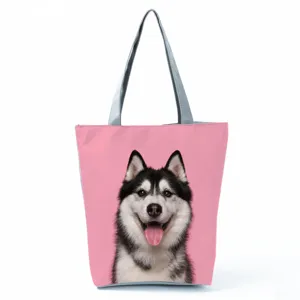 Detailed view of the cute husky printed canvas tote bag with pink background and grey straps.
