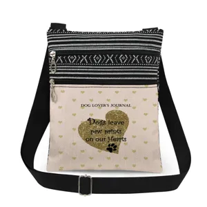 Sac bandoulière avec sangle réglable, double fermeture éclair et motif patte de chien dorée.