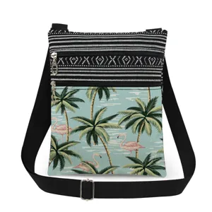 Detailed close-up of tropical flamingo print crossbody bag with black white stripes and zippers.