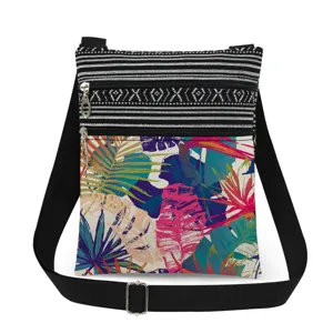 Close-up detail view of the vibrant tropical leaf print pocket and double metal zippers.