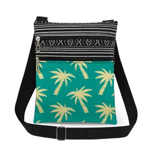 Canvas crossbody bag with palm tree print, dual zippers, adjustable black strap, casual chic.
