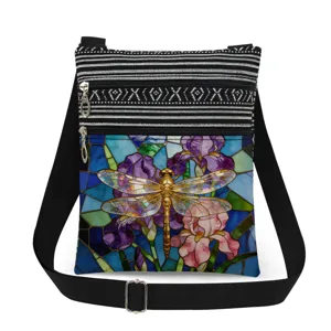 Detailed view of a fashionable crossbody bag featuring a stained glass dragonfly and floral print.