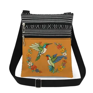 Hummingbird print canvas cross-body bag detail view, dual zip pockets, stylish daily wear.