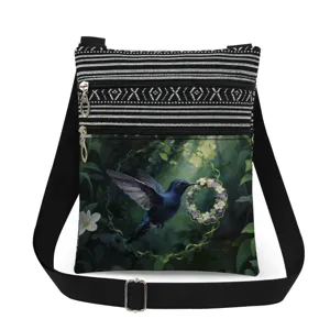 Small crossbody messenger bag featuring a lovely hummingbird print and chic black white stripes.