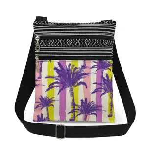 Canvas crossbody bag with palm tree print and dual zippers, adjustable shoulder strap.