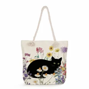 Detailed view of the black cat floral tote bag, featuring sturdy rope handles and large capacity.