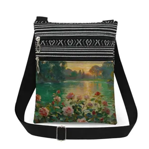 Close-up of artistic oil painting print crossbody bag with black strap and double zippers.