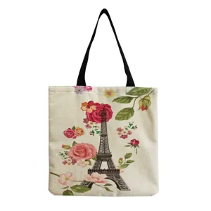 Detailed view of the canvas tote bag featuring Eiffel Tower and floral print pattern, practical.