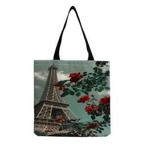 Canvas tote bag featuring Eiffel Tower and red rose print, large capacity casual shoulder bag.