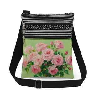 Casual canvas crossbody bag with floral oil painting print, double zippers and black strap.