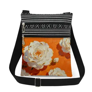 Crossbody shoulder bag with dual zippers, black-white stripes and orange floral print.
