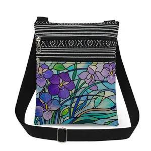 Details of a lightweight crossbody bag with double zippers, purple floral print and adjustable strap.