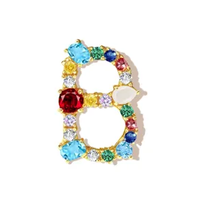 Detailed close-up of a colorful cubic zirconia letter B pendant jewelry accessory.