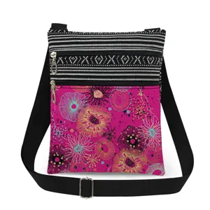Detailed view of the colorful floral print crossbody shoulder bag with double zipper design.