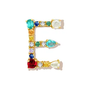 Detailed close-up of colorful gemstone letter E pendant, crafted with vibrant multi-color stones.