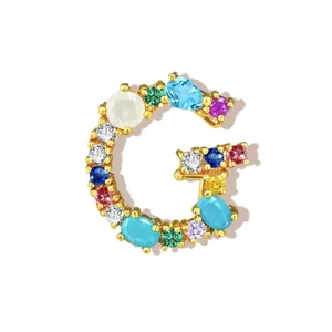 Close-up detail view of the colorful cubic zirconia letter G necklace pendant accessory.
