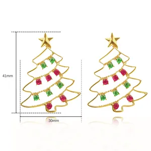 Christmas tree earrings featuring red and green stones, stylish holiday fashion jewelry detail.