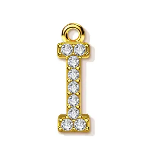 Gold letter I pendant close-up, pavé zirconia stones, luxury shiny metallic jewelry detail