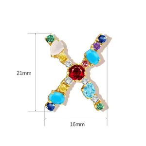 Close-up detail of the colorful crystal letter X pendant, showing size dimensions and stone setting.