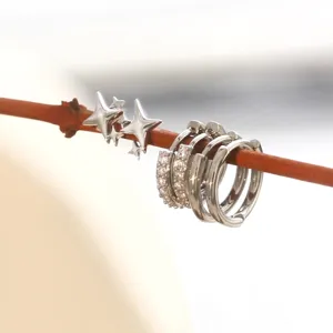 Silver tone star stud and rhinestone hoop earrings set, detailed close-up product view.