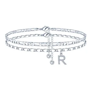 Catenina cavigliera doppia argentata con ciondolo lettera R in zircone per donna.