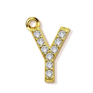 Gold letter Y pendant detail showcasing sparkling paved cubic zirconia stones and metal loop.