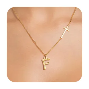 Minimalist gold-tone necklace featuring an asymmetrical cross and letter F pendant.