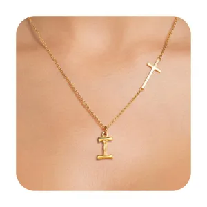 Detailed view of gold cross initial letter pendant necklace, elegant clavicle chain design.