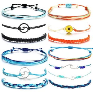 Handmade woven braided rope bracelets set with wave and sunflower charms for beach surfing style.