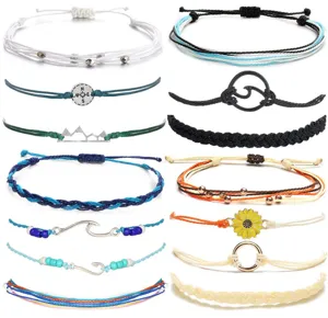 Handmade braided rope bracelets set with surf charms, compass, and multi-color cord designs.