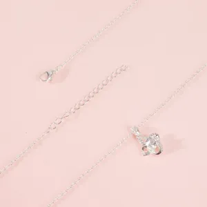Silver intertwined clover pendant necklace detail view, elegant jewelry gift for women.