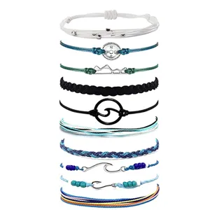 Set of handmade braided rope bracelets with surf charms, adjustable friendship cord jewelry.