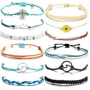 Handmade woven rope bracelets set with compass and sunflower charms for women beach.