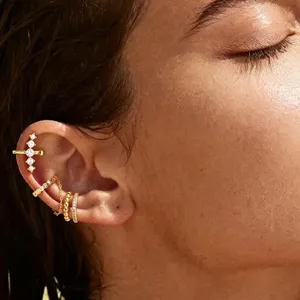 Gold-plated cartilage ear cuff set with sparkling cubic zirconia chain design for women.