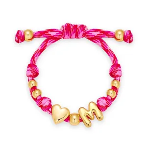 Trendy roze geweven koord armband met gouden kralen, hart en letter M bedels voor vrouwen